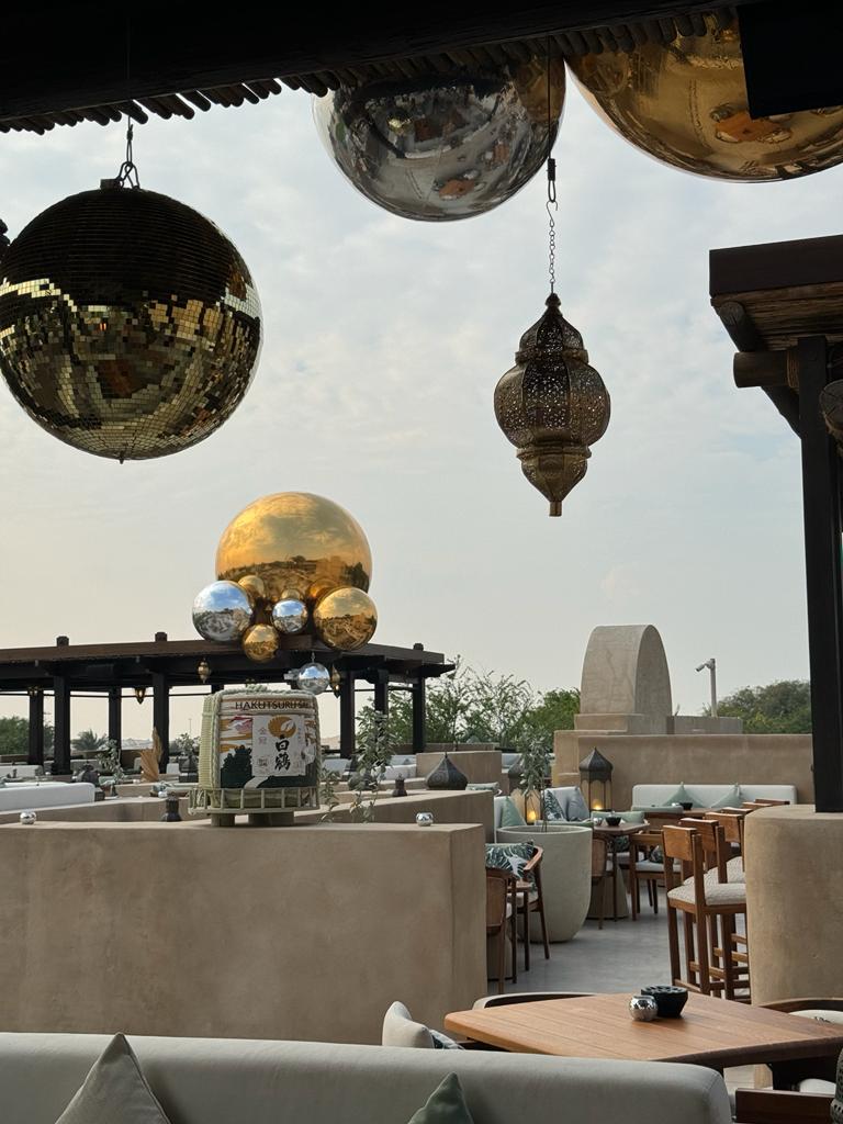 Evolution Prop Shop lanterns and mirrored disco decorations layered throughout Bab Al Shams.