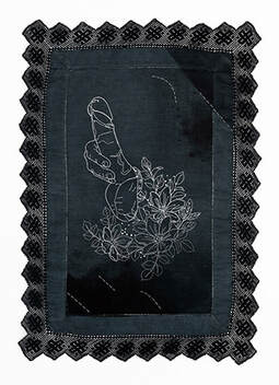 An embroidered erection sprouting from a bunch of flowers. White and embroidery on black dyed and spray died linen with a black lace trim.