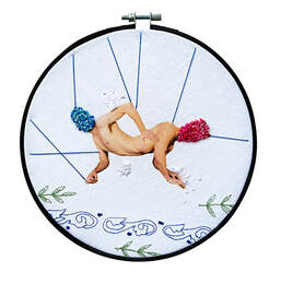 Embroidery and print displayed in a black embroidery hoop. Two male forms joined at the waist with face covered in brightly coloured french knots.