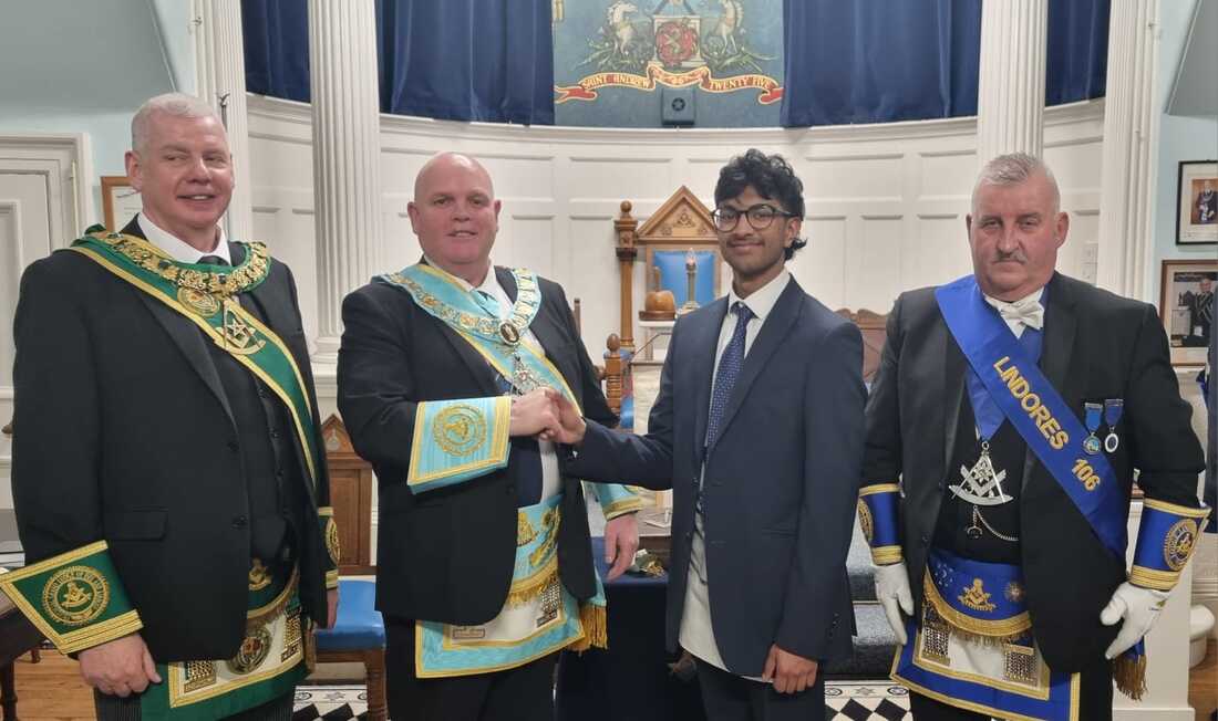 brother gupta being congratulated by our rw brother john niven accompanied by the rwm of lodge lindores and the pgm brother bill rocks pm