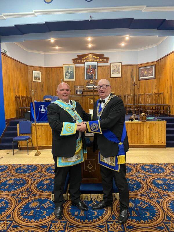 RWM bro John niven being welcomed into lodge barrhill twechar no.1444 by rwm brother gavin brown
