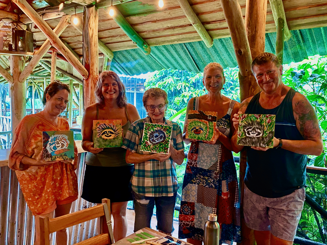 Artists-showing-off-sloths-Sloth-Paint-Your-Own-Art-Class-Costa-Rica-by-Angeline-Marie-Martinez-july2022