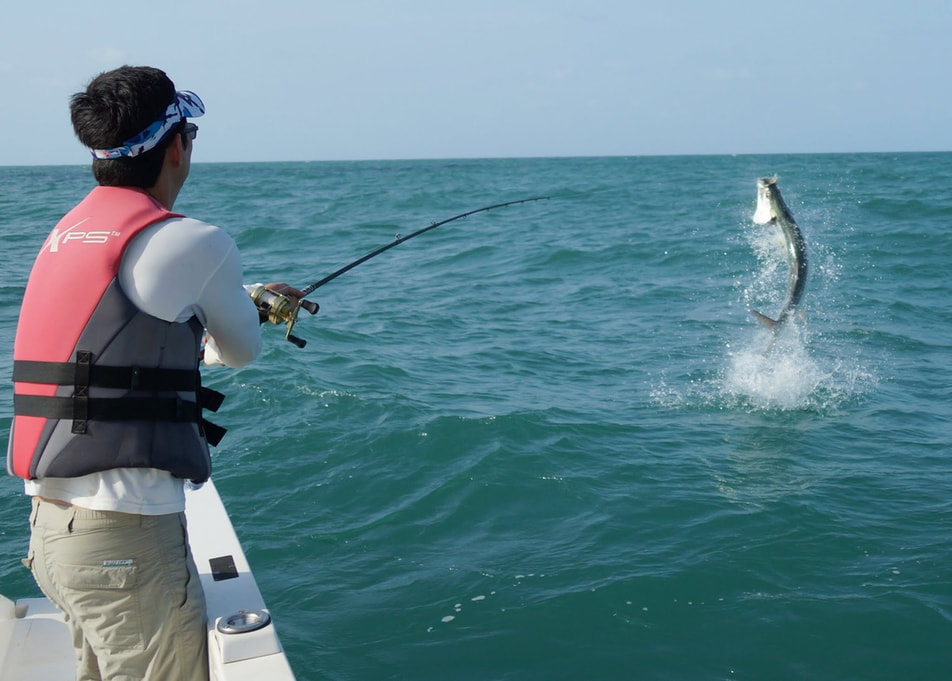 The author fighting a Tarpon in Nicaragua hooked on a jig.