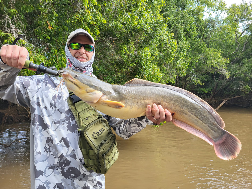 The author's friend Gary with a nice Sharptooth caught in the Malagarasi River, Tanzania