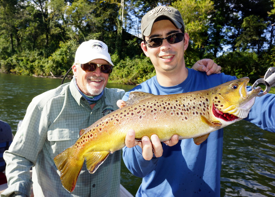 The author with a Brown Trout caught on a jerk bait on the White River in Arkansas