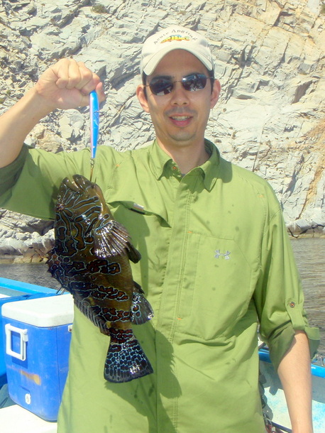 A rare Clown Hawkfish caught on a Yo Zuri Crystal Minnow cast next to a boulder near shore in Baja, Mexico