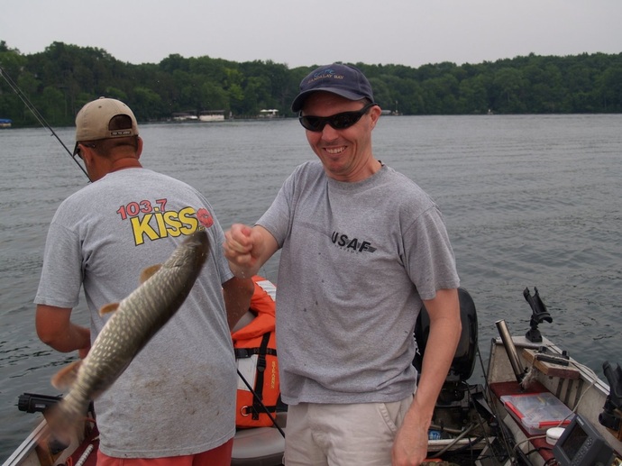 My friend Rob demonstrating how to properly grasp a Pike in Pine Lake, Wisconsin