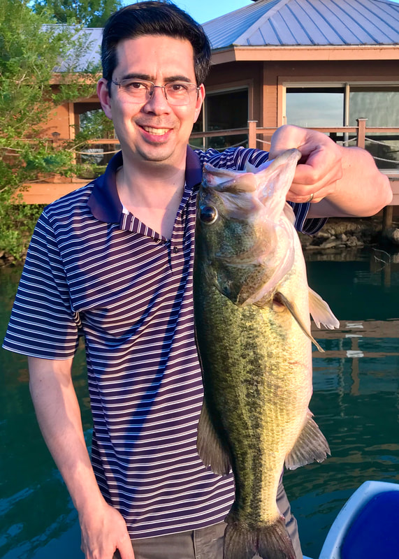 A healthy bass caught in Texas on a plastic crawdad after work