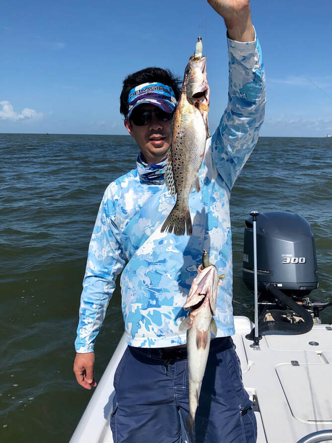 Two Speckled Trout at a time near Cocodrie, Louisiana