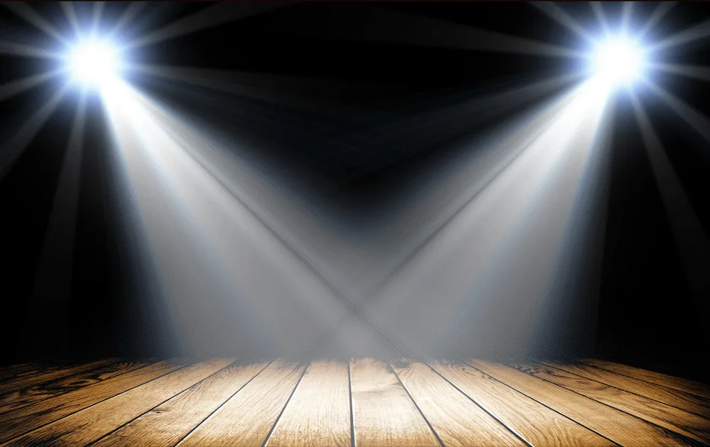 Stage lit up with 2 bright spot lights_the importance of music at events_blog for Saxophonist for Hire, Essex, London, Kent, Sussex, Surrey.