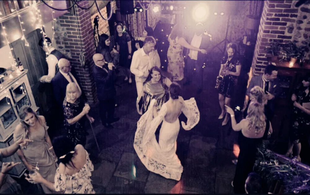 wedding reception guests dancing with live Saxophonist_hire a saxophonist for your winter wedding_blog for Saxophonist for Hire in Essex, London, Surrey, Kent and Sussex.