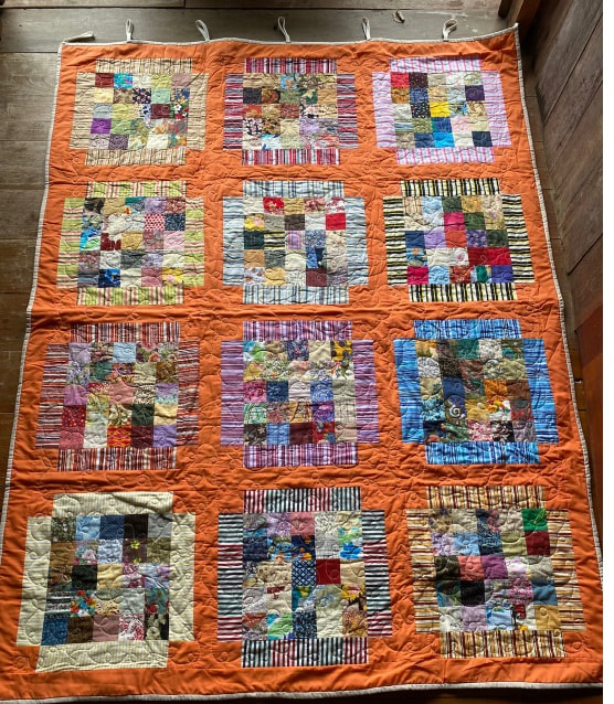 Inset pattern orange border quilt