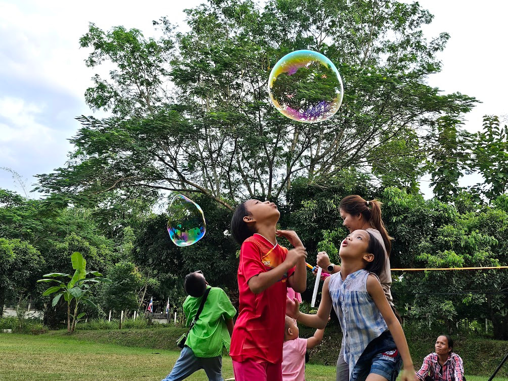 Spending the afternoon playing in our field with giant soap bubbles