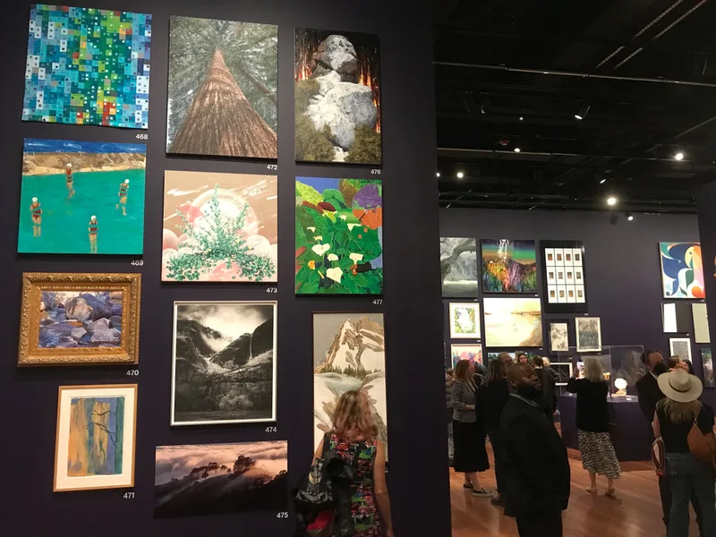 Eric Wong's Redwood tree painting in the gallery for the artist preview opening of The de Young Open 2023
