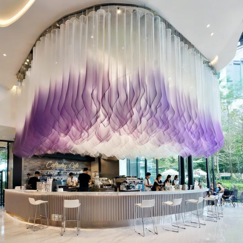 Fabric Drapery enhancing the ambiance of cafes or boutiques
Semi-Transparent Fabric Panels Ceiling Decoration

