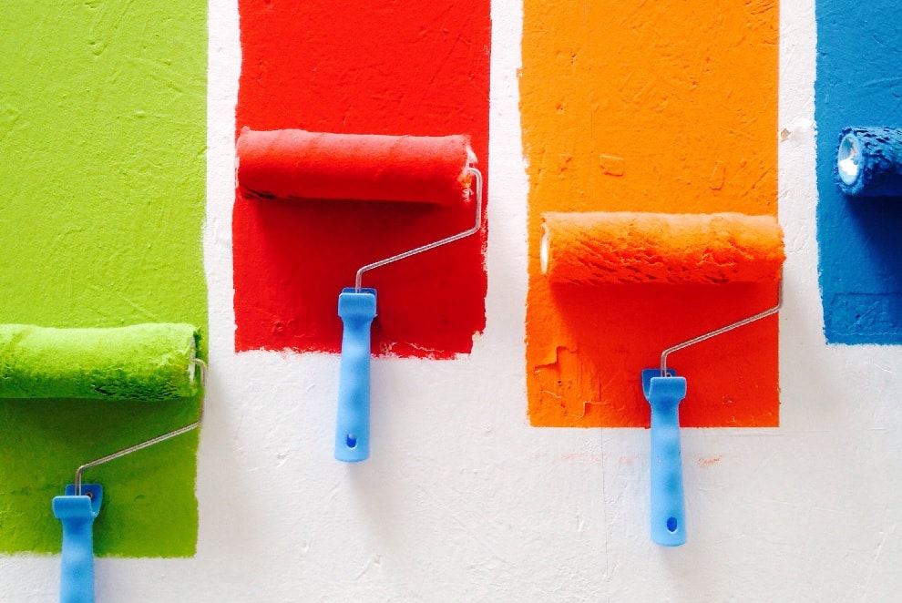rollers of different colours side by side_plastering and rendering services_gk rend