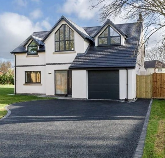 Newly rendered white house with new drive_plastering and rendering services_gk rend
