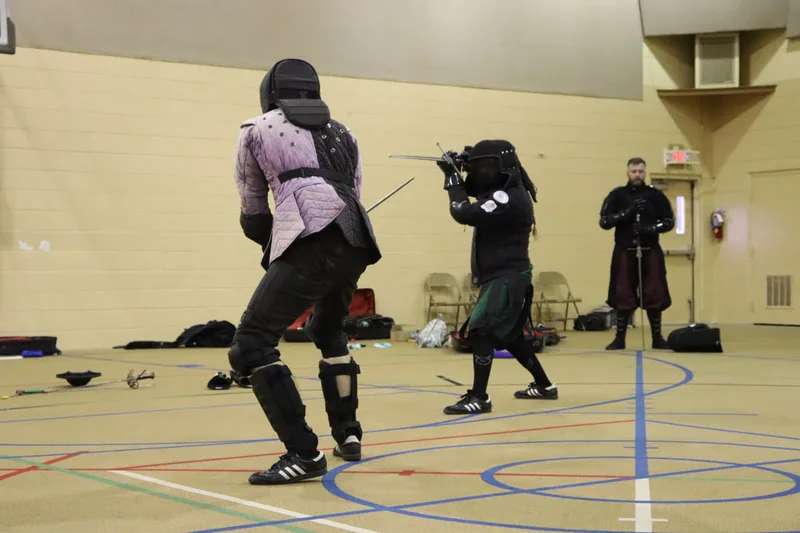 Instructor Jason and Free Scholar Billy in longsword guards.