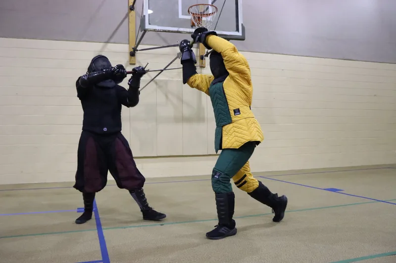 Free Scholars Avery and Nathan in a longsword bind.