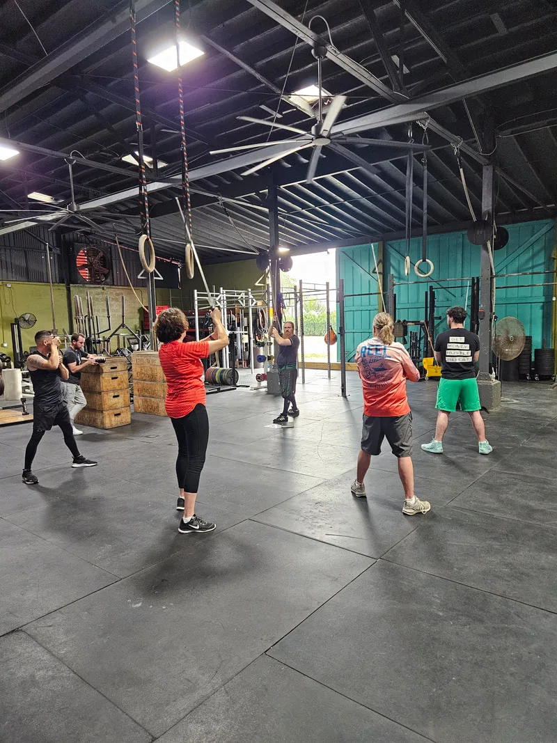 Instructor Jason leads new adult students through  a trial class.