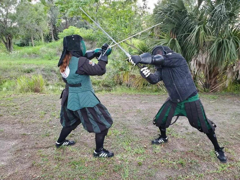 Instructors Amanda and Jason in a longsword bind.