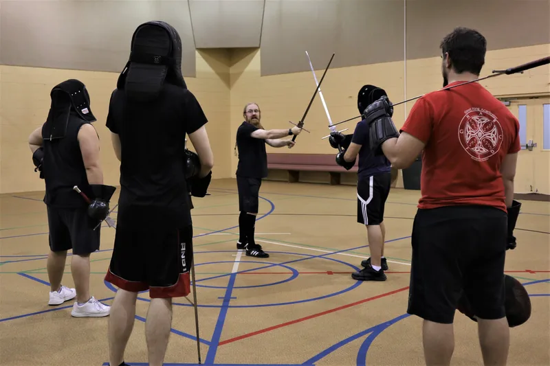 Instructor Jason leads a Longsword lesson during adult class.