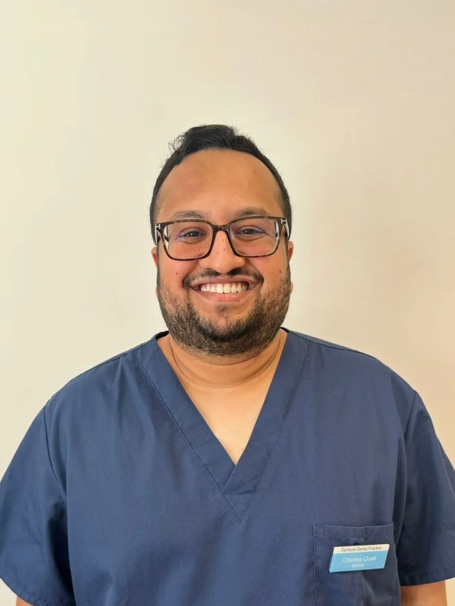 Charles Quail Dentist providing dental implant treatment at Dunluce Dental.