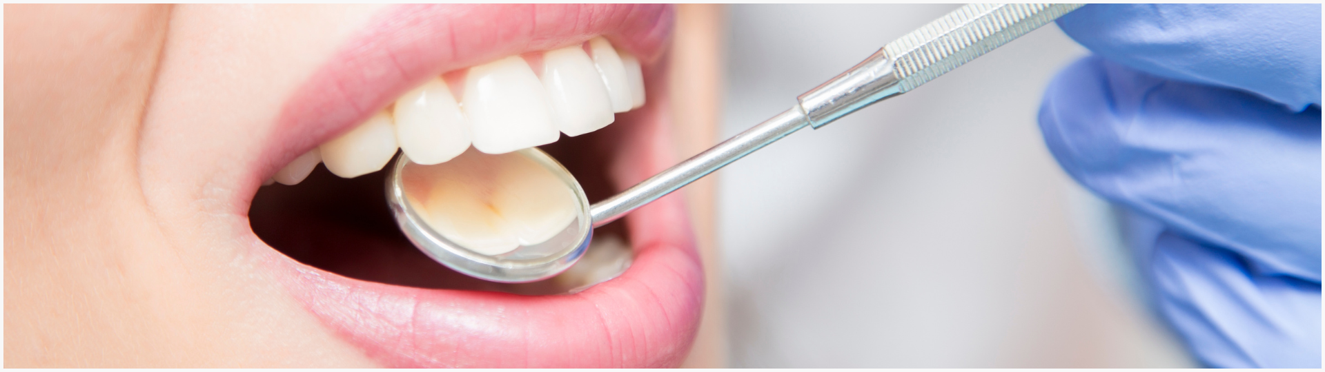 Patient at a dental check up with dentist.