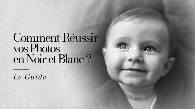 Portrait en noir et blanc d'un enfant souriant aux yeux clairs - Article : Comment Réussir vos Photos en Noir et Blanc : le Guide
