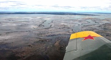 An aerial photo of Western Port at low tide shows how shallow much of the bay is. Photo: Kevin Chambers