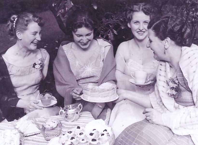 Goldie Guthrie serving sponge cake to three young women at the hospital garden party, 1955. Photo: W&DHS