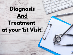 Text saying Diagnosis and treatment at your 1st visit on a wooden table with keyboard and stethoscope
