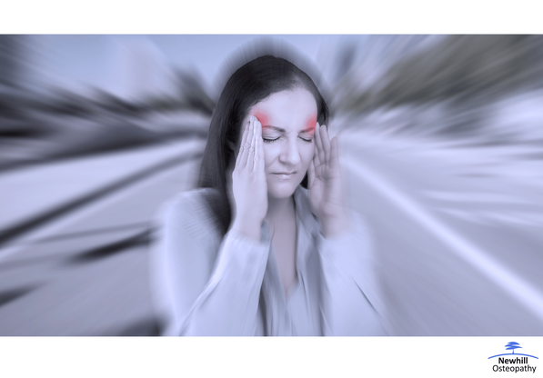 Person holding their head while suffering with a migrane.