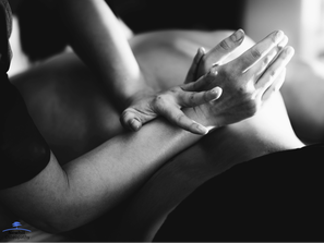 osteopath massaging someone's back