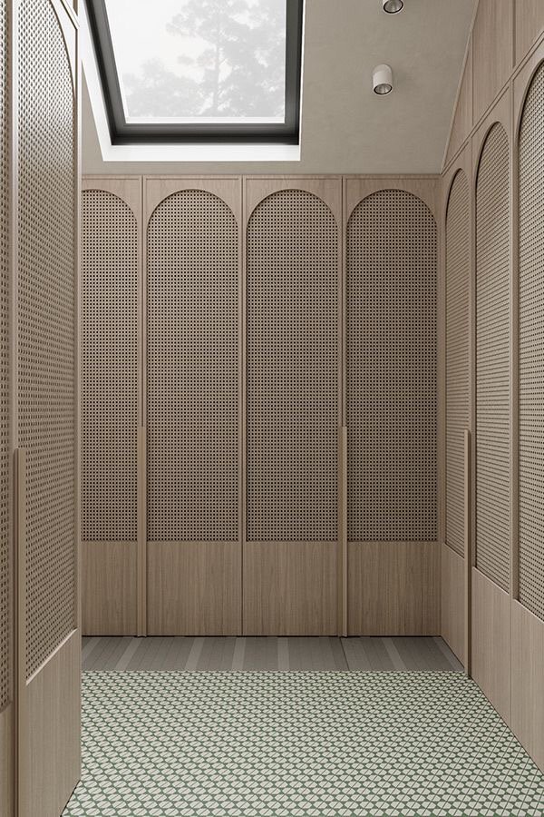 Arched built-in closet with open shelving and cabinet doors