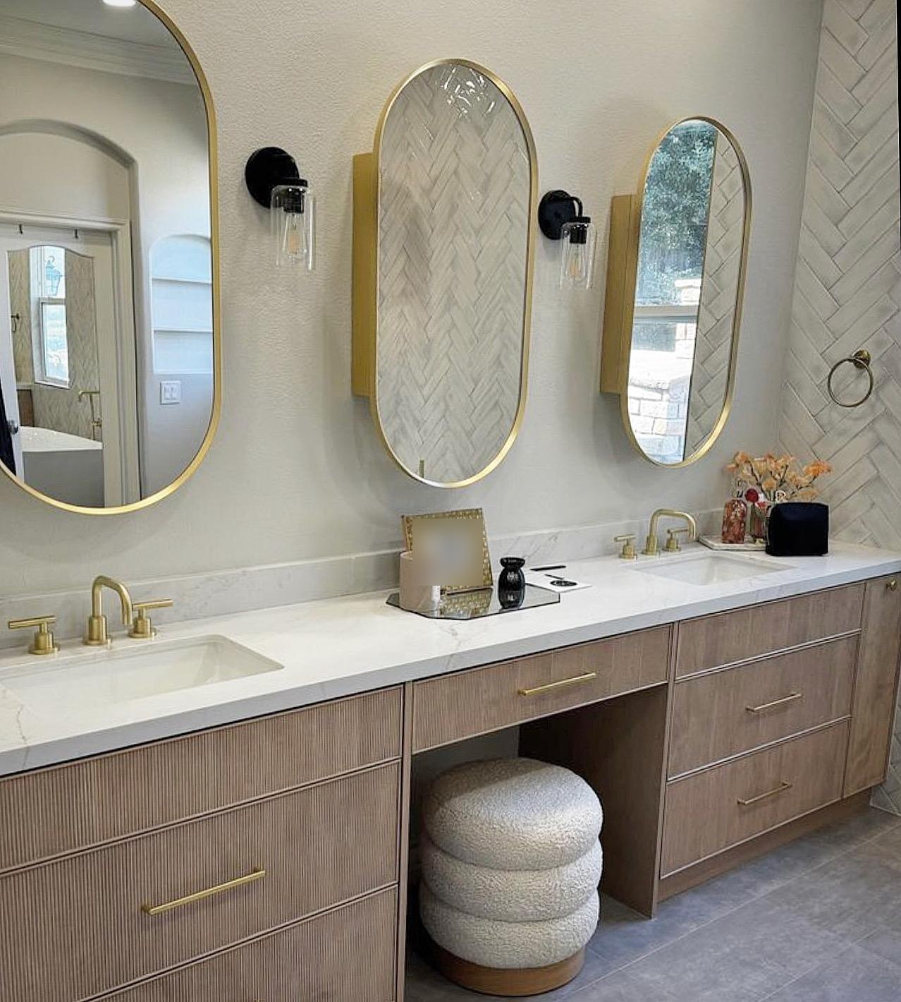 Primary bathroom double fluted wood vanity with three oval mirrors by Jill Seidner Interior Design