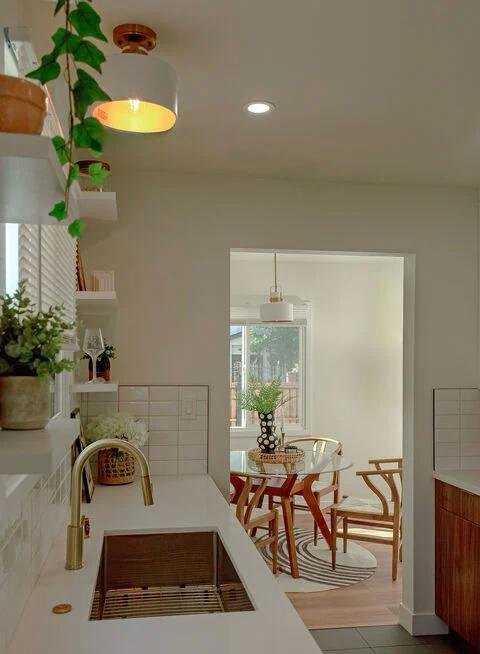 White kitchen sink looking into the dining room by Jill Seidner Interior Design