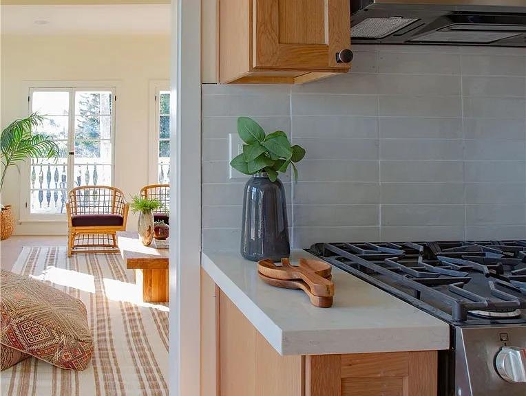 Wood kitchen open to the living room by Jill Seidner Interior Design