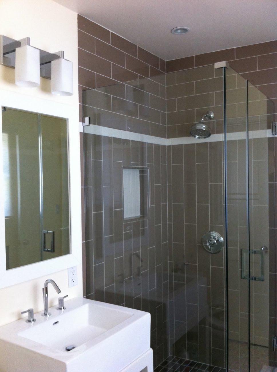 Bathroom with a gray tile glass shower by Jill Seidner Interior Design