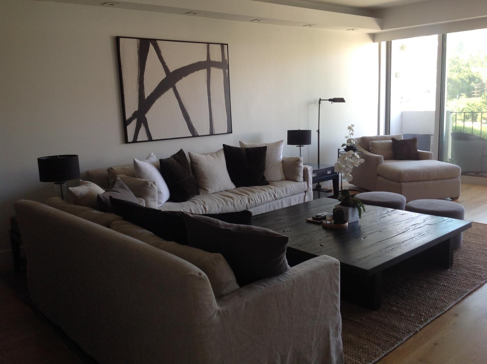 Living room with gray sofas and large abstract art by Jill Seidner Interior Design
