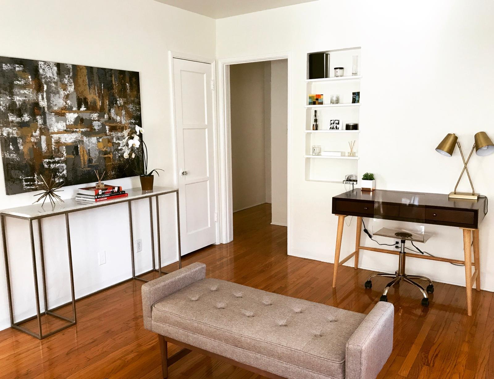 Living room with an entry console, bench and desk by Jill Seidner Interior Design