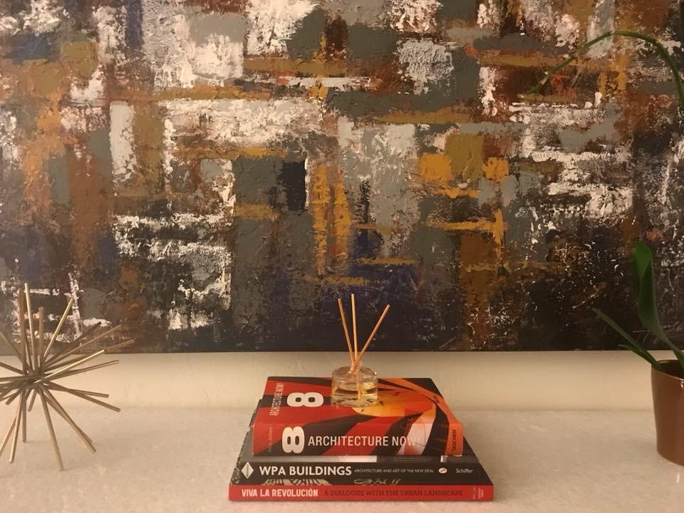 Large abstract art over a styled console by Jill Seidner Interior Design