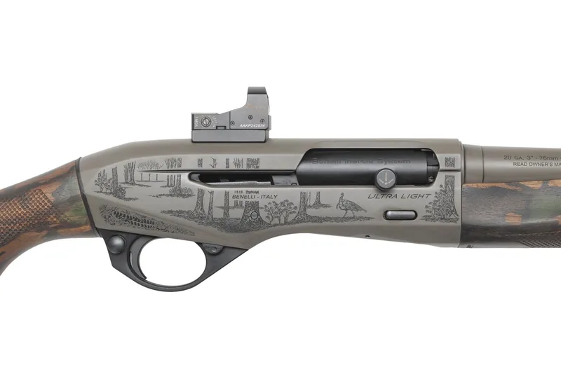 Close-up of a laser-engraved woodland turkey scene on a Custom Grey Cerakote Benelli Ultra Light 20 gauge receiver