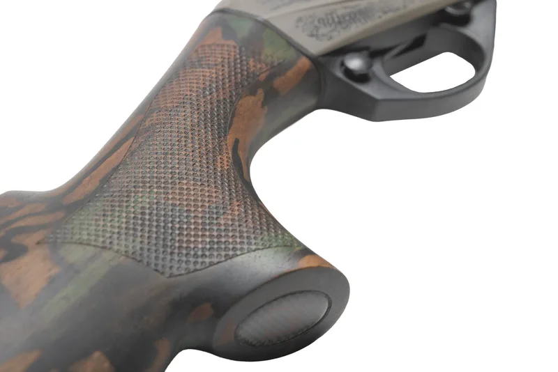 Close-up of the camo walnut pistol grip on a Benelli Ultra Light 20 gauge with a Custom Grey Cerakote receiver
