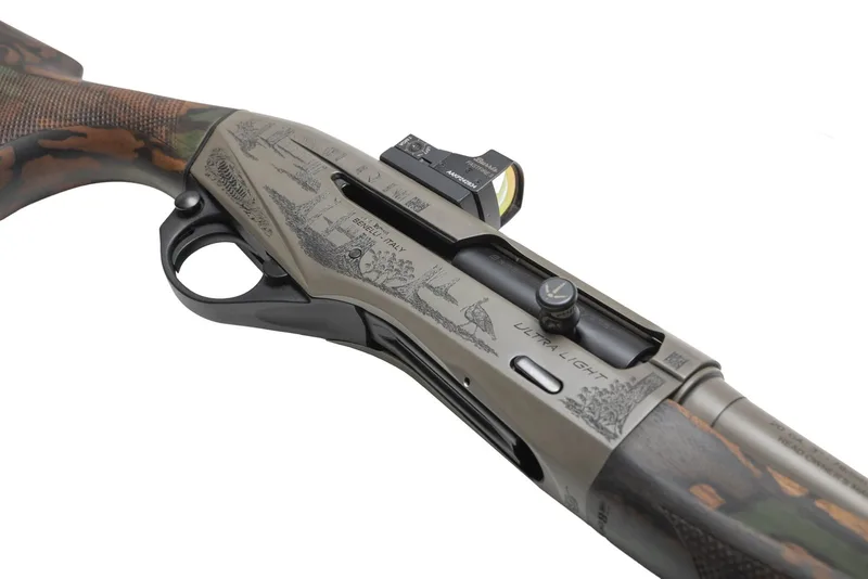 Angled top view of a laser-engraved Custom Grey Cerakote receiver on a Benelli Ultra Light 20 gauge