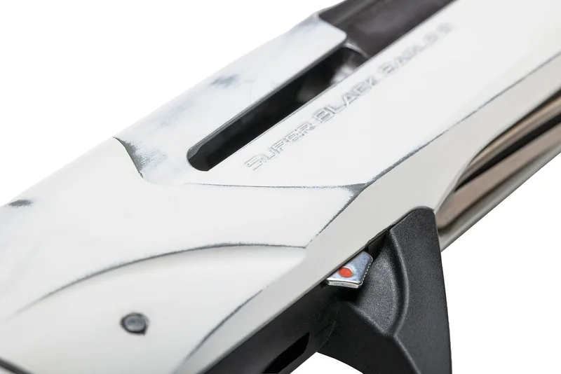Close-up of the Super Black Eagle 3 lettering on an Antiqued Snow White Cerakote receiver
