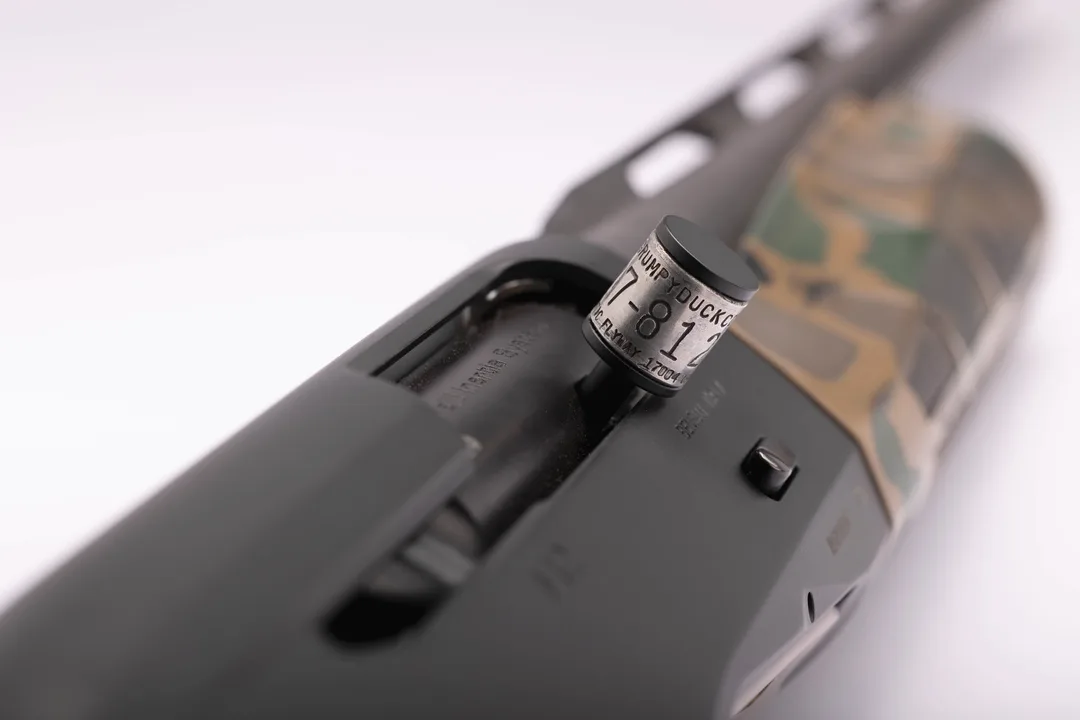 Custom Cerakoted semi-auto shotgun featuring a Grumpy Duck Co. titanium bolt handle, finished by GD Classics in Belleville, PA.