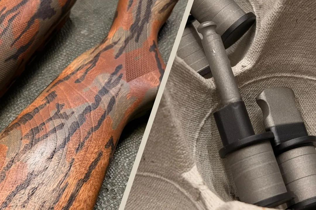 Custom tiger-stripe Cerakote stock beside Grumpy Duck Co. titanium bolt handles
