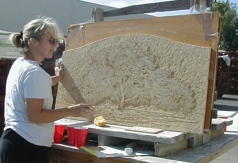 Artist Jamie Santaniello staining the Promised Land Oak Tree hand carved Jerusalem stone slab for Ms Oprah Winfrey's kitchen backsplash in her Montecito, Ca. Mansion in 2003. jamiesantaniello.com. Copyright©JS2003