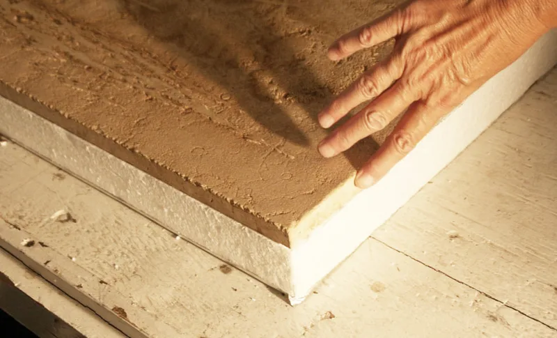 Picture showing the 3/4" thickness of the hand carved Jerusalem stone slab that was installed into Oprah Winfry's kitchen stove top in her Montecito, Ca mansion in 2003. Artist Jamie Santaniello  jamiesantaniello.com  Copyright©JS2003